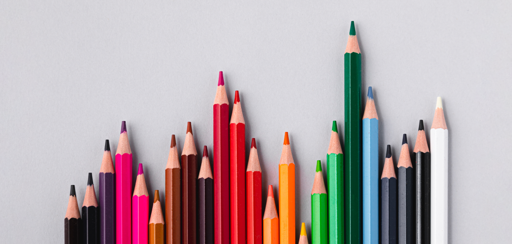 A row of colored pencils mimics  the shape of a graph. The variety of colors suggests the broad diversification possible with ETFs.