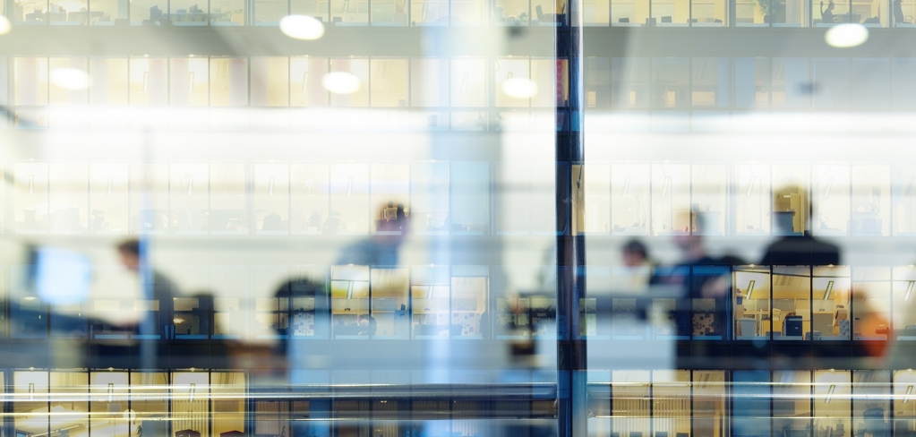 Reflection of employees in a window