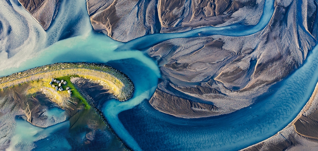 An aerial view of a river delta and its tributaries across the landscape.