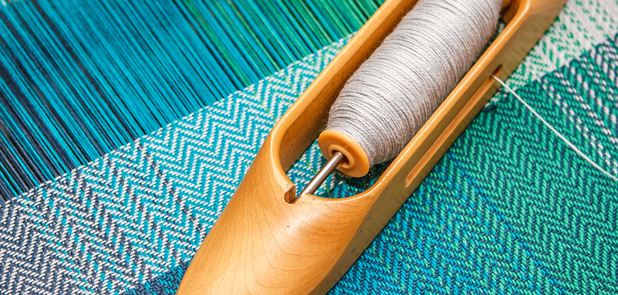 Blue threads on a loom