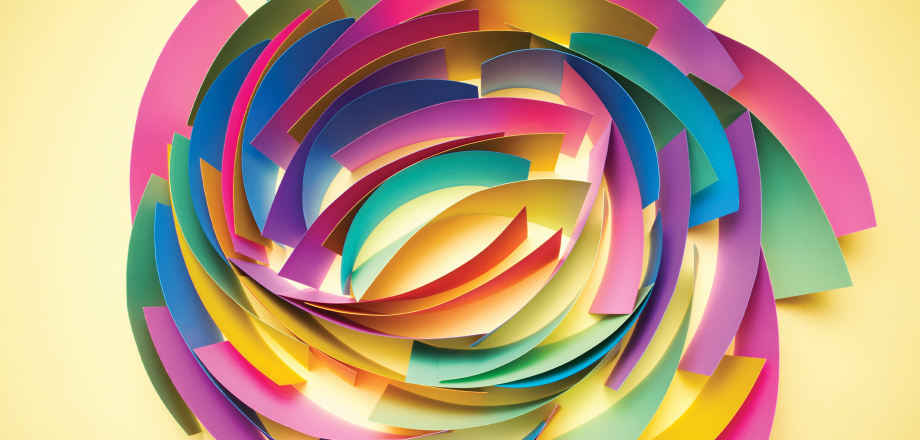 A swirling pattern of colorful paper strips on a yellow background, suggesting distribution.